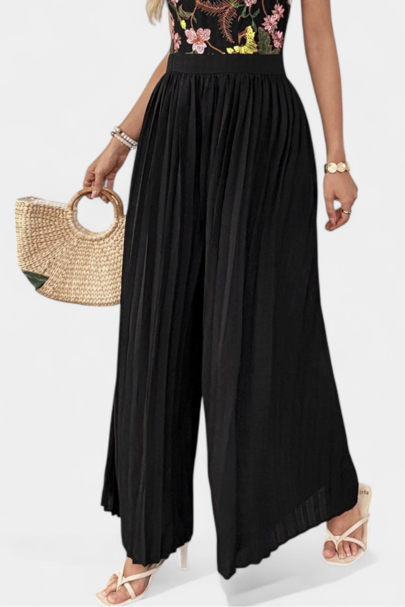 Maruja™ | Tuta palazzo con pizzo floreale e corpetto strutturato